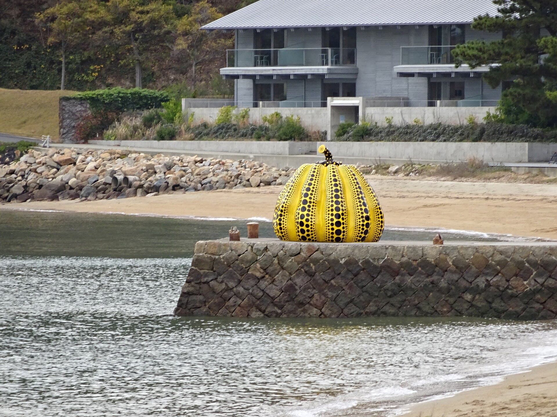 Yayoi Kusama's yellow Pumpkin on its pier at Benesse Art Site Naoshima, Japan, in December 2025.